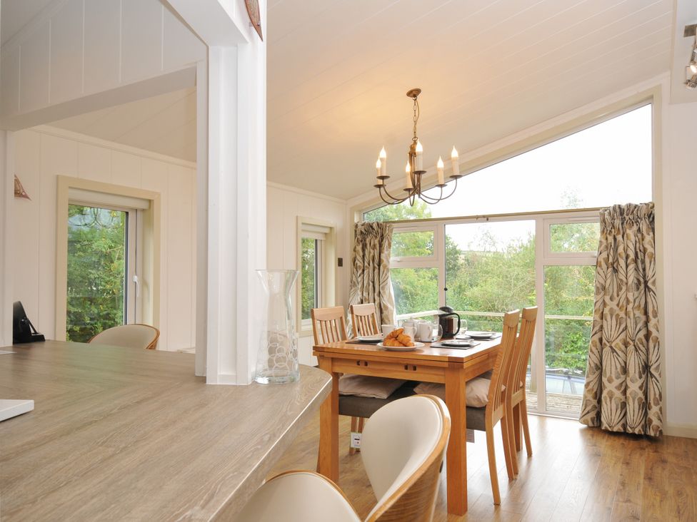 A dining room with a table and chairs at 5 Tree Tops in Dobwalls
