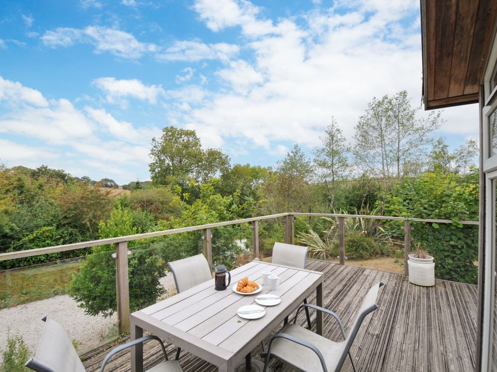 An outdoor area with a table and chairs at 5 Tree Tops Dobwalls