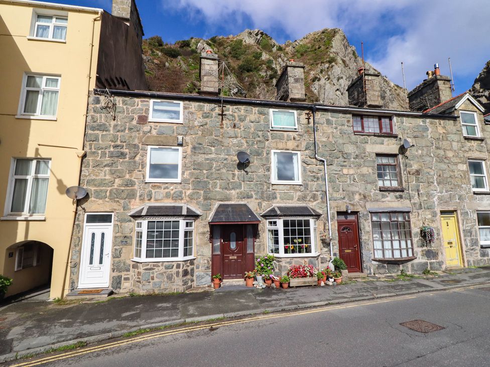 A stone building with multiple doors and windows at 1 Glanaber Terrace