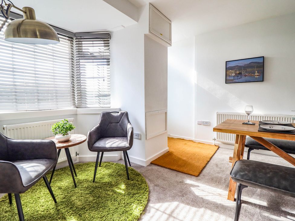 A living room with chairs and a table at 1 Glanaber Terrace