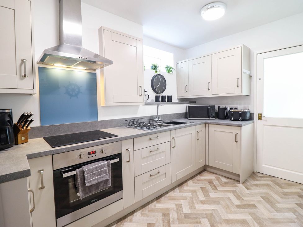 A kitchen with appliances and cabinets at 1 Glanaber Terrace 
