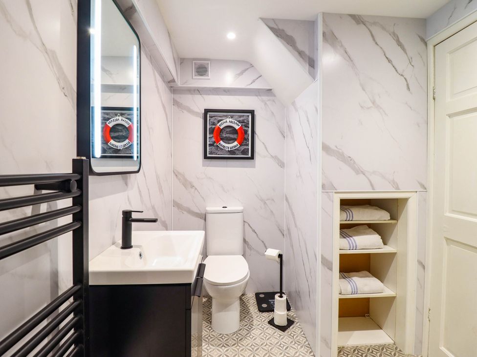 A bathroom with a sink and toilet at 1 Glanaber Terrace
