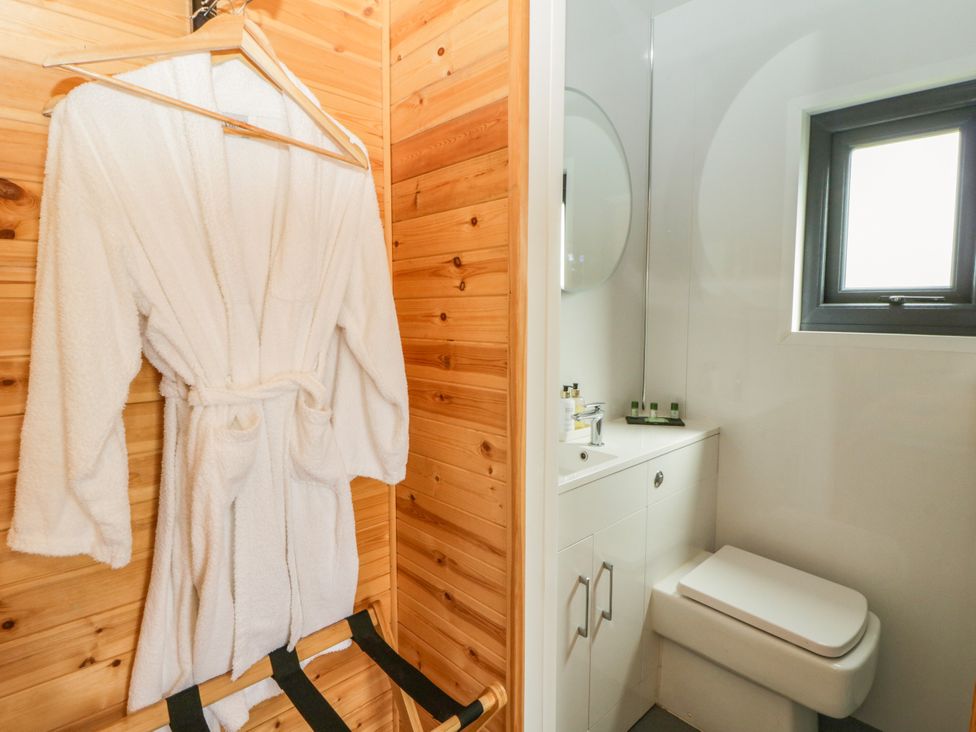 A bathroom with a sink and toilet at Sycamore Lodge in Brecon
