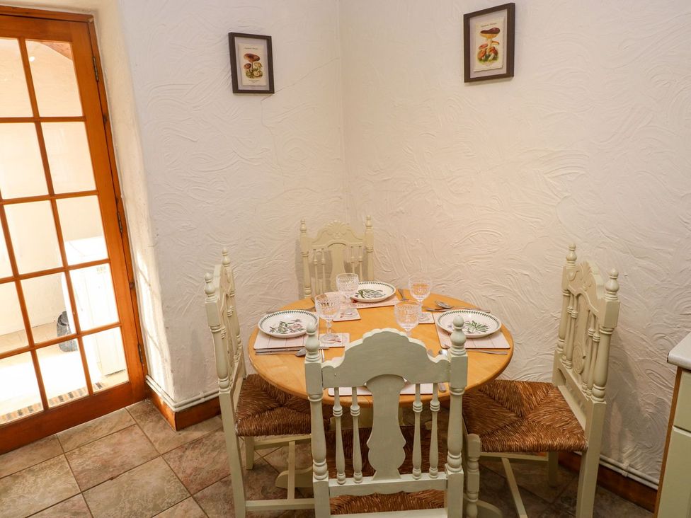 A dining room with a table and chairs at The Stable in Haverfordwest