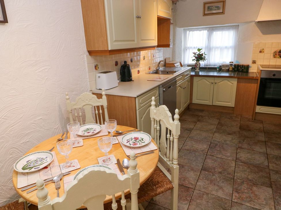 A kitchen with a dining table and chairs at The Stable in Haverfordwest