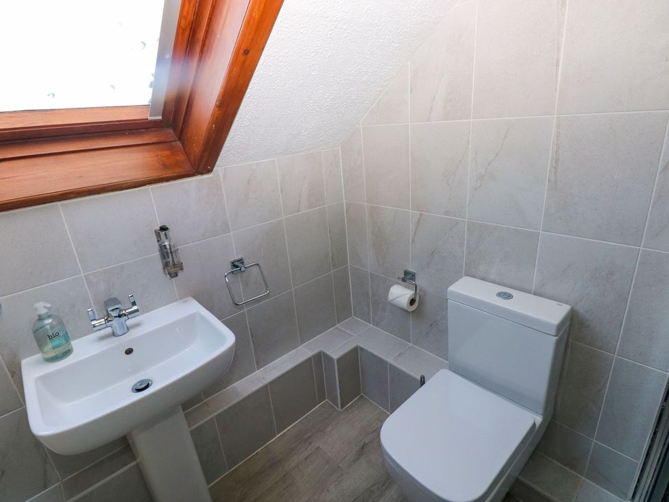 A bathroom with a sink and toilet at The Stable in Haverfordwest