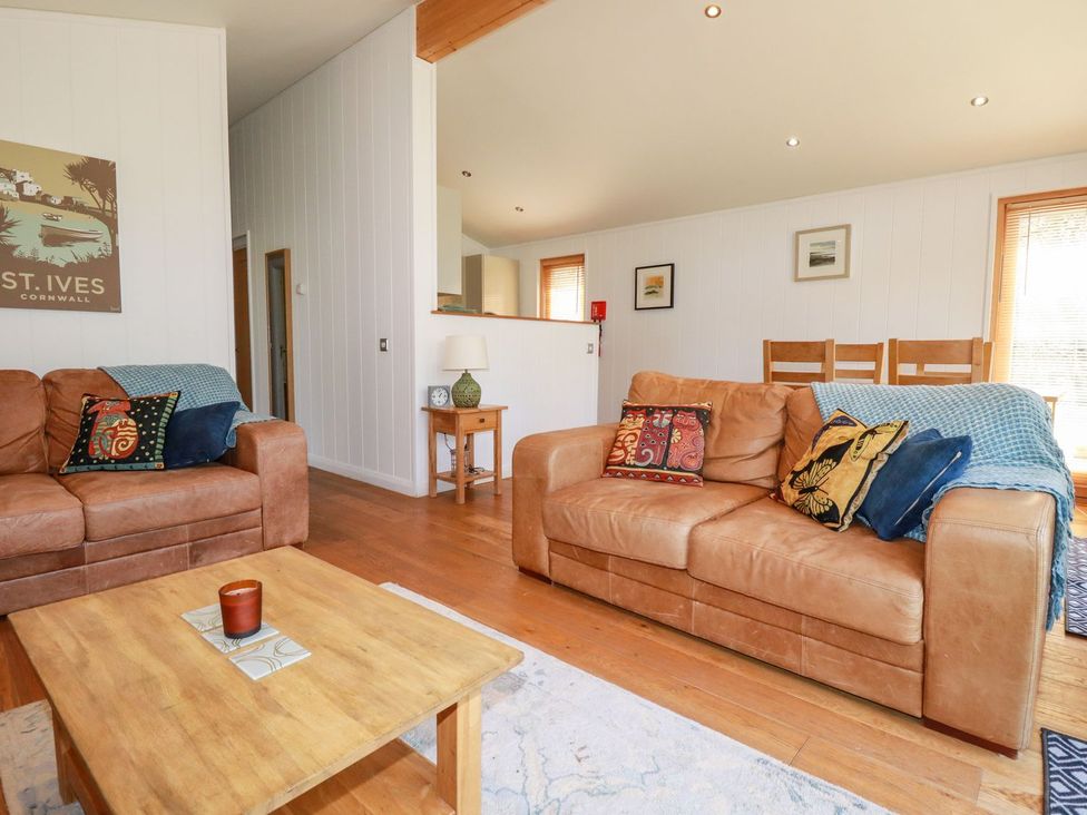 A living room with two sofas and a coffee table at 7 Stonerush Valley, Looe
