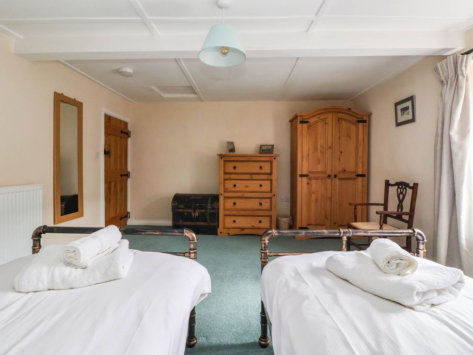 A bedroom with two beds and a dresser at South View in Richmond
