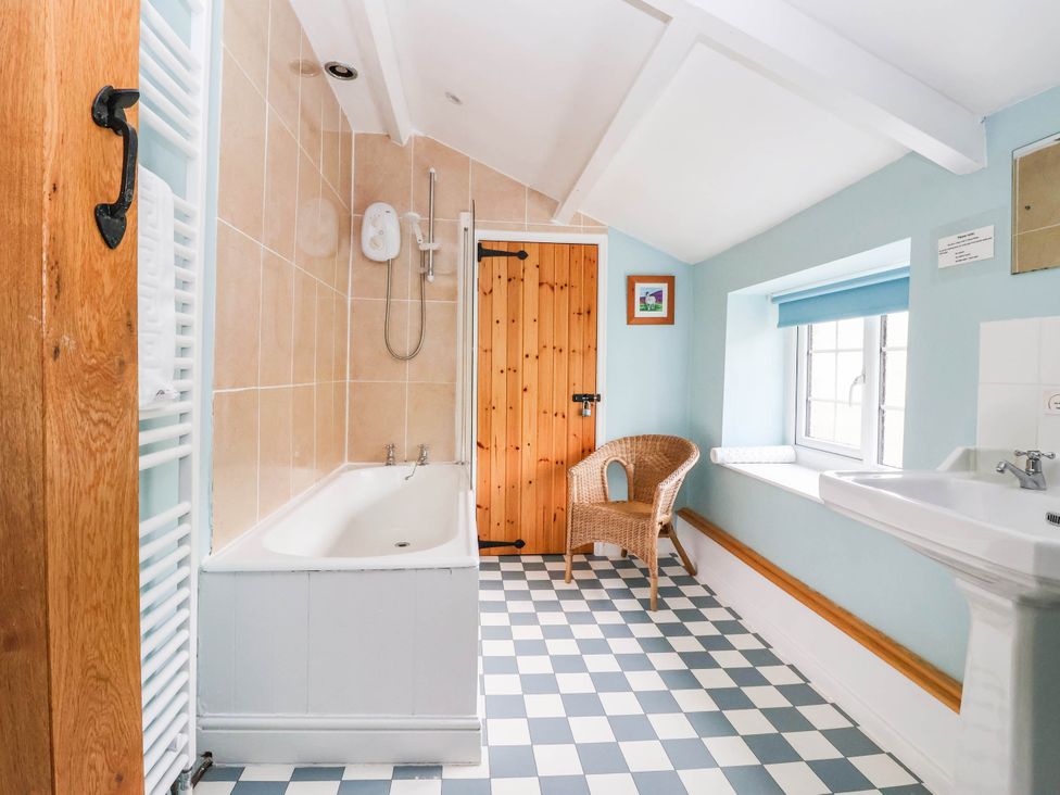 A bathroom with a bathtub and sink at South View in Richmond