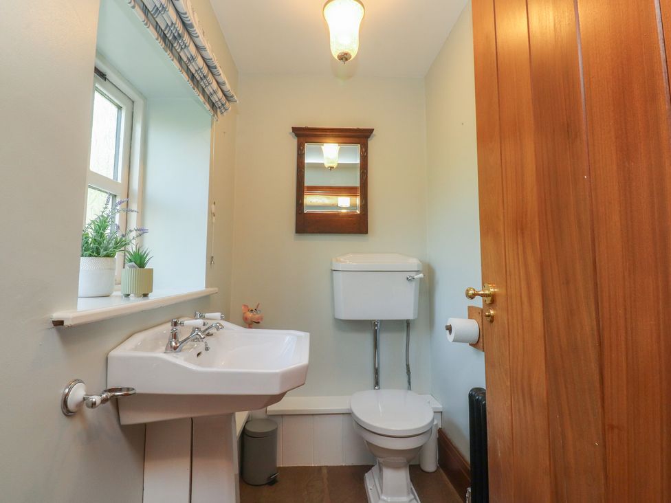 A bathroom with a sink and toilet at The Shippon in Ormskirk