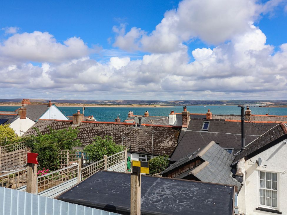 A view of rooftops and the sea at 1 Tideways in Bideford