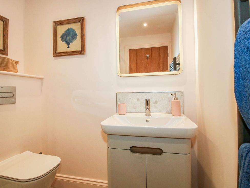 A bathroom with a sink and toilet at Little Red Barn in Wallop near Westbury