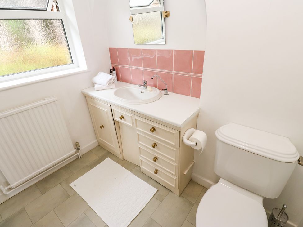 A bathroom with a sink and toilet at 12 The Dell Bardsey near Wetherby
