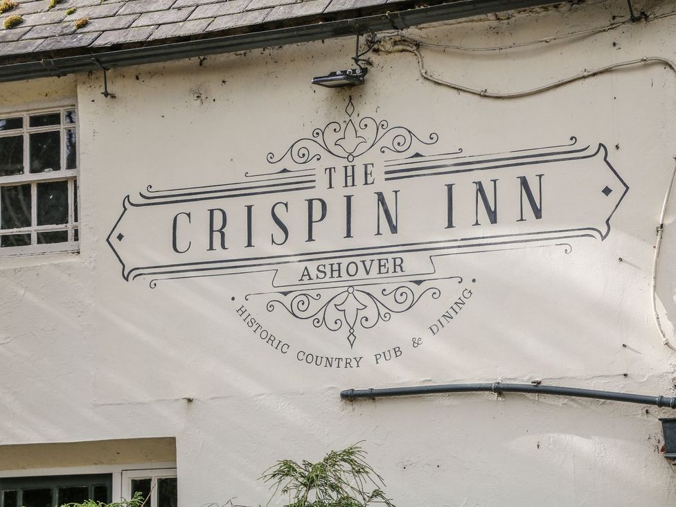 A sign for The Crispin Inn in Ashover