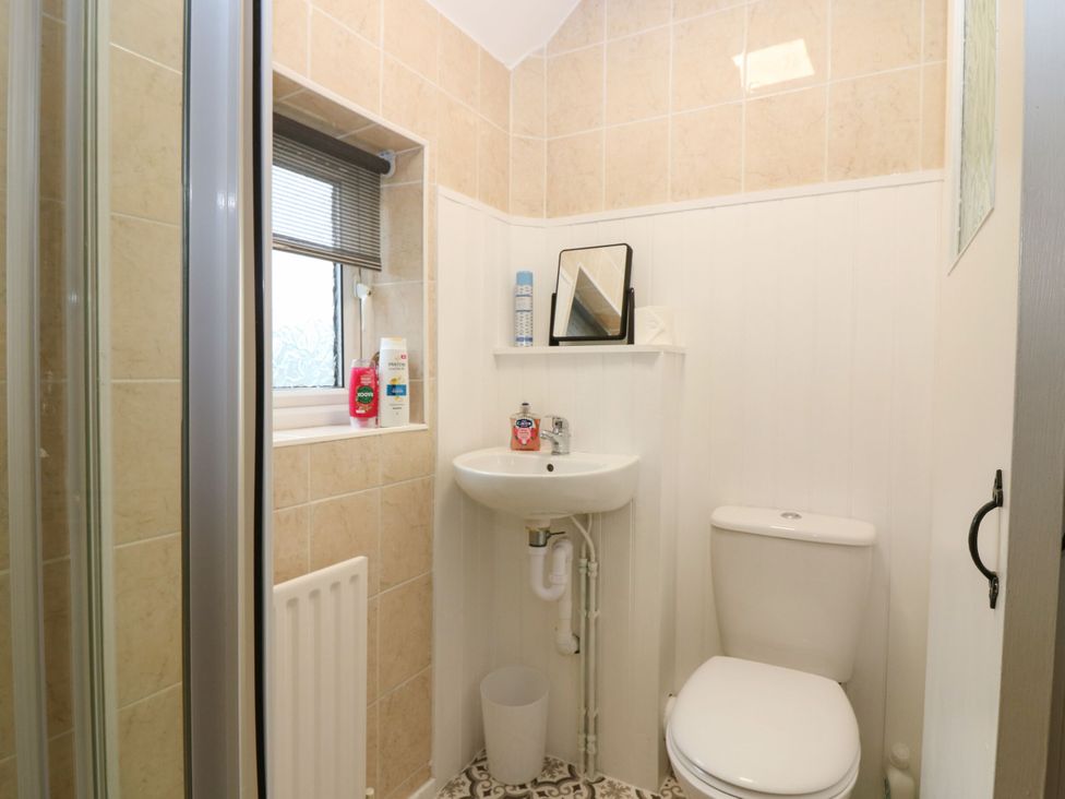 A bathroom with a sink and toilet at Hill View Studio in Hawick