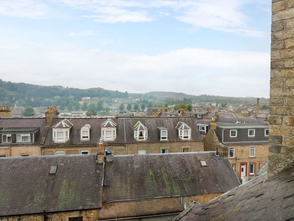 A view of rooftops and hills at Hill View Studio in Hawick