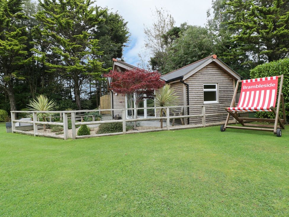 An outdoor view of a house with a garden at Brambleside Lodge in Truro