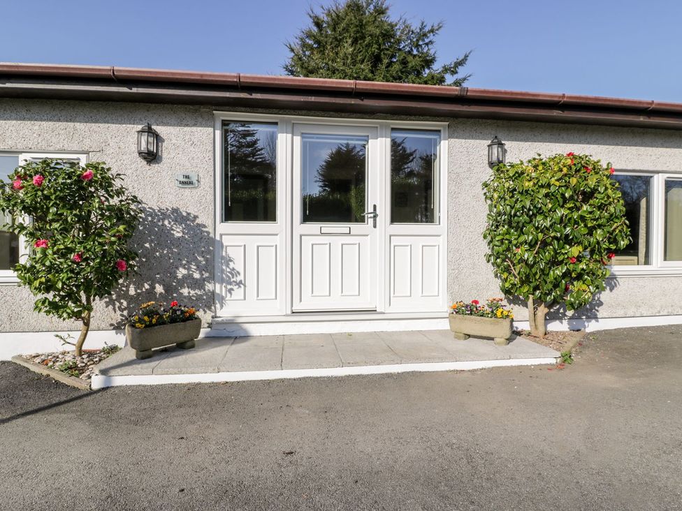 An entrance with a white door and planters at Lower Brambleside in Truro