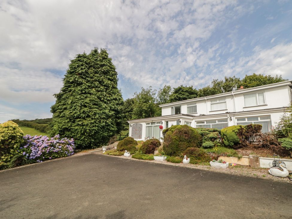 A house with landscaping features at Mourne Mountains View in Dunmurry