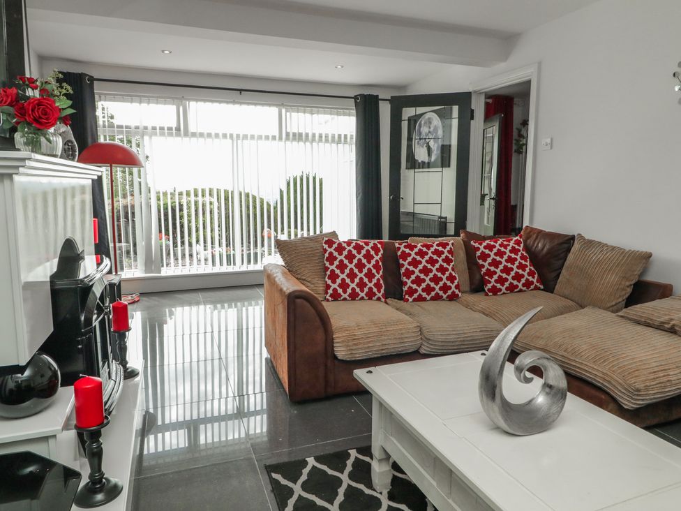 A living room with a couch and a coffee table at Mourne Mountains View in Dunmurry