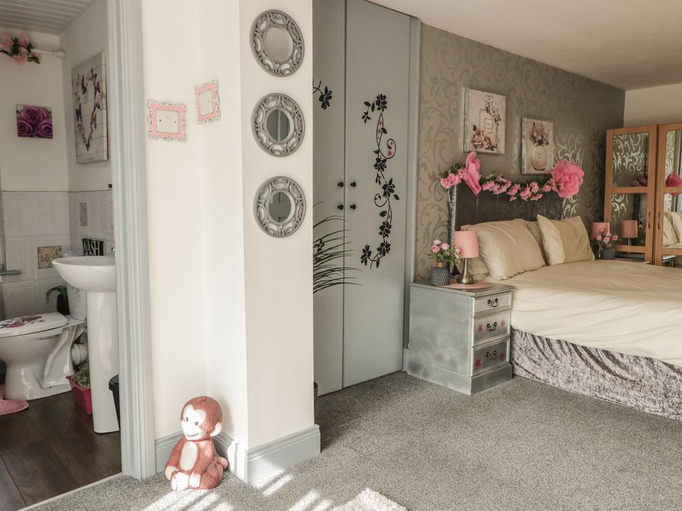 A bedroom with a bed and nightstand at Mourne Mountains View in Dunmurry