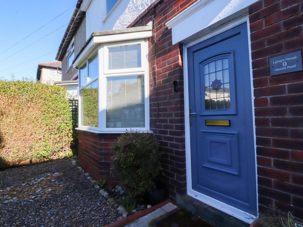 An entrance with a blue door and hedges at Lytham House Lytham St. Annes