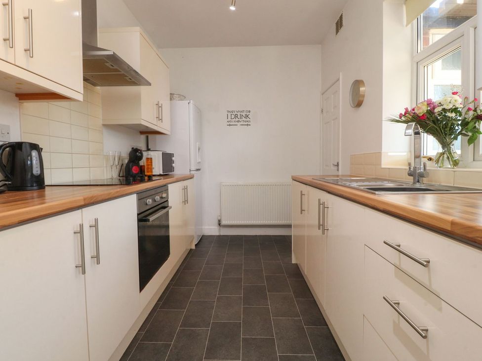 A kitchen with appliances and counters at Lytham House in Lytham St. Annes
