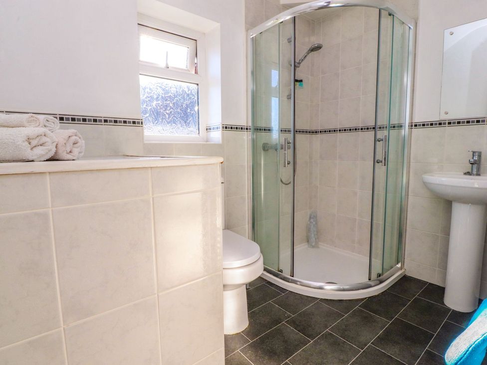 A bathroom with a shower and sink at Lytham House in Lytham St. Annes