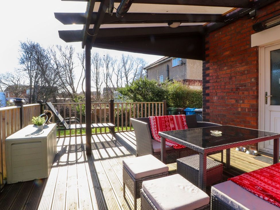 An outdoor patio with furniture at Lytham House Lytham St. Annes