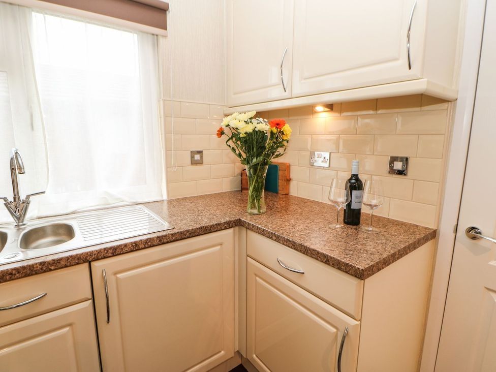A kitchen with a sink and countertop at 10 Poppy Lodge in Richmond