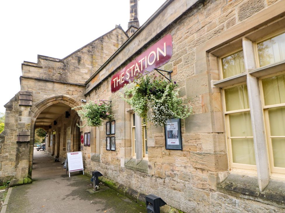An exterior view of The Station with planters at 10 Poppy Lodge Richmond