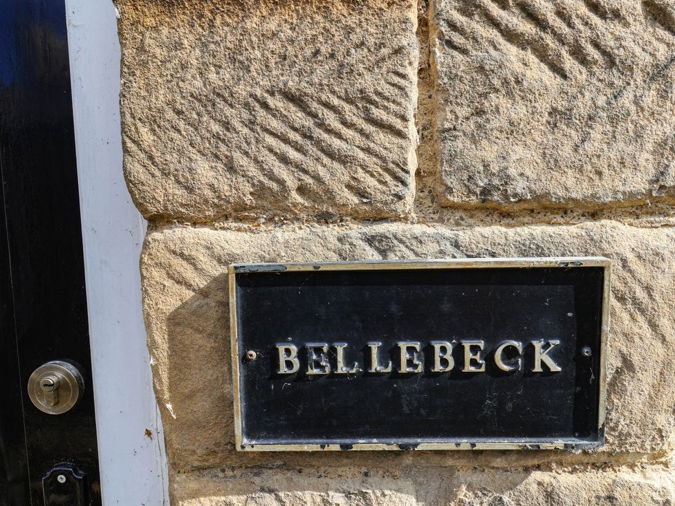 A wall with a sign that reads BELLEBECK at bellebeck