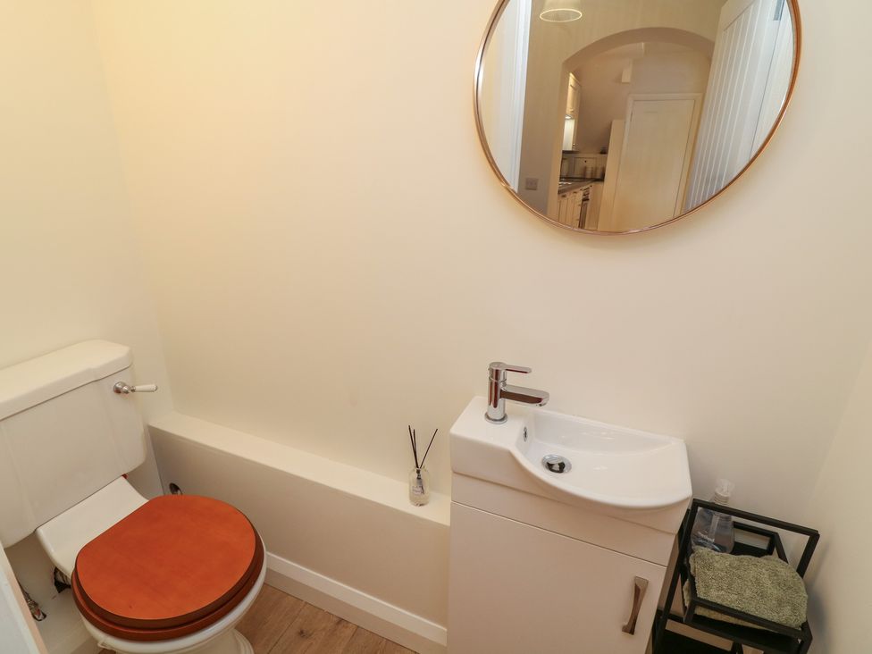 A bathroom with a toilet and sink at No.40 Rufford Road in Ruddington