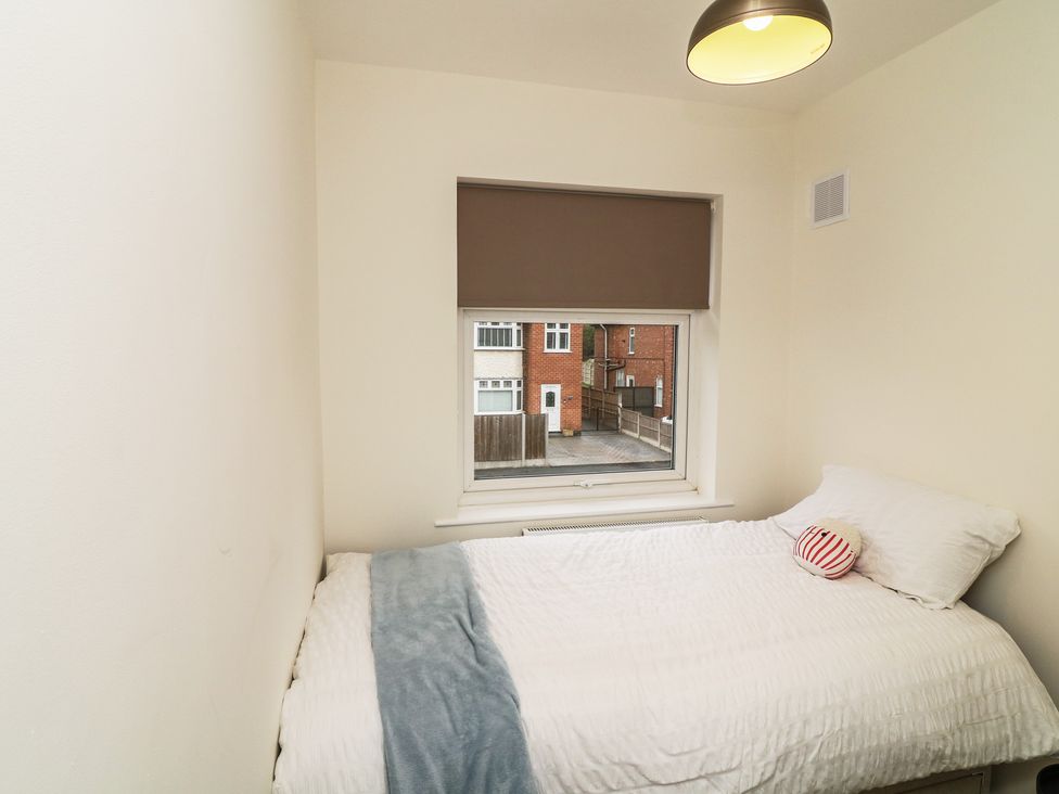 A bedroom with a bed and window at No.40 Rufford Road Ruddington