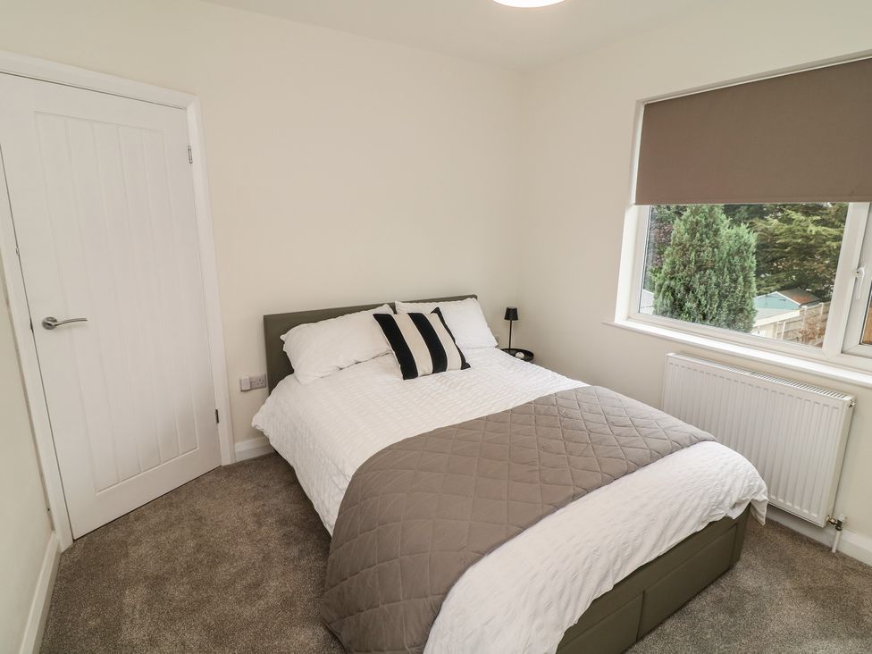 A bedroom with a bed and window at No.40 Rufford Road in Ruddington