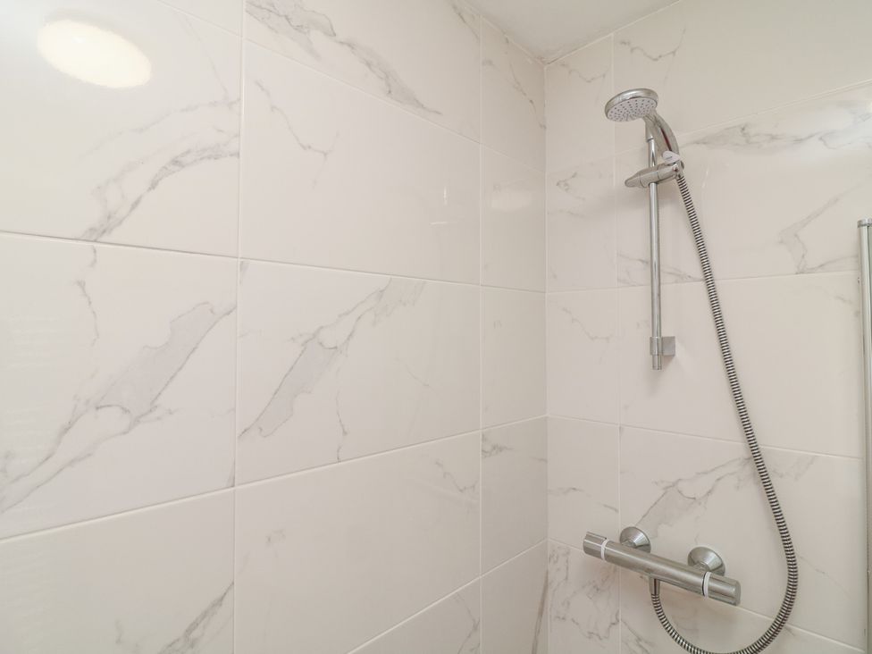 A shower area with wall tiles and a showerhead at No.40 Rufford Road, Ruddington