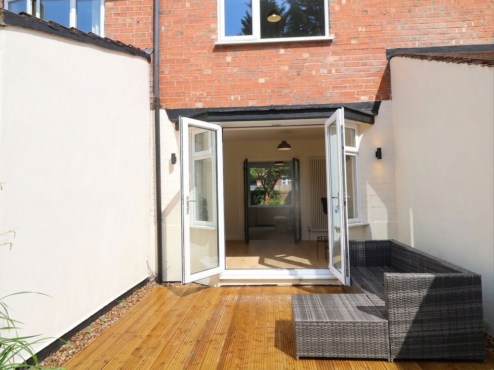 An outdoor seating area with double doors leading inside at No.40 Rufford Road in Ruddington