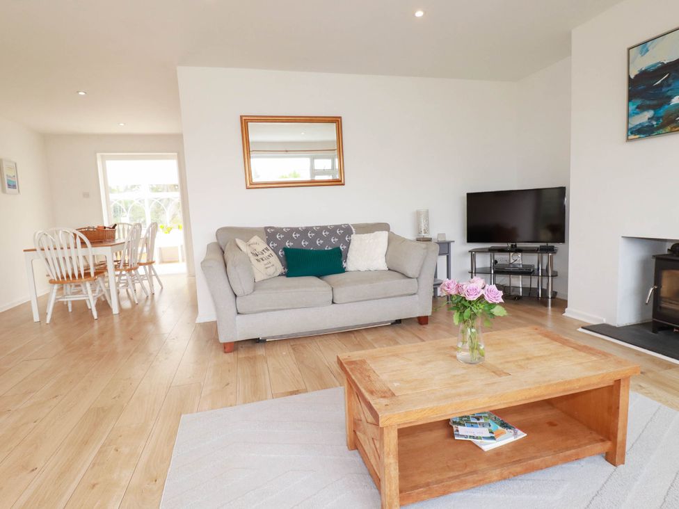 A living room with a sofa and coffee table at Cloudbreak in Wadebridge