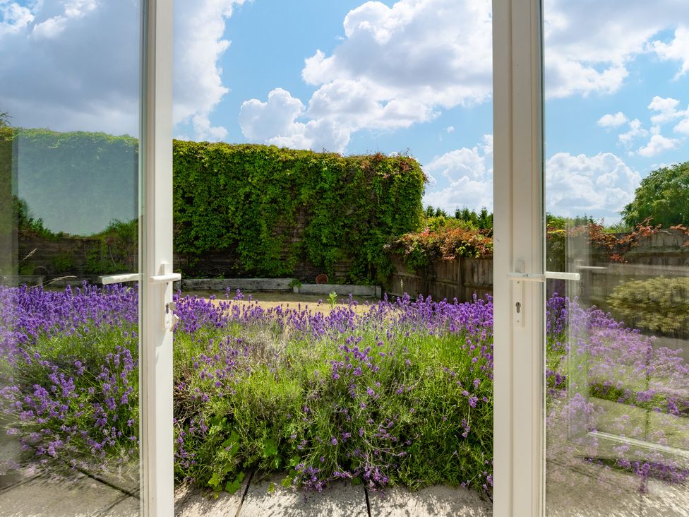 A garden view with lavender and walls at Charming Countryside Cottage in Blandford Forum