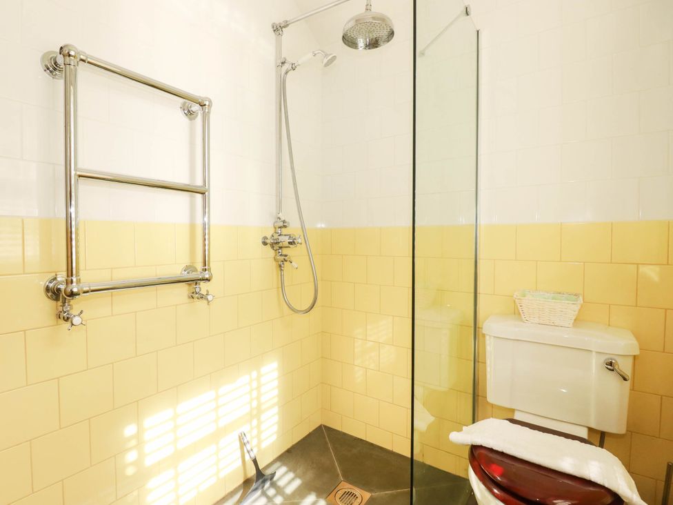 A bathroom with a shower and toilet at The Homestead in 