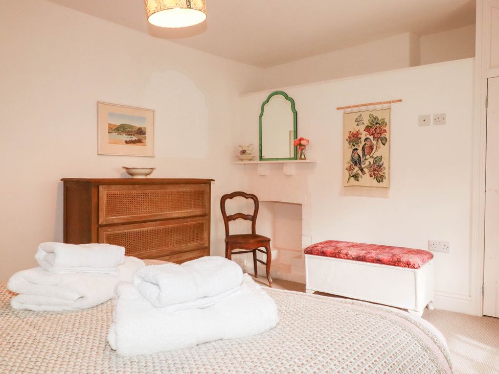 A bedroom with bed and furniture at The Homestead 