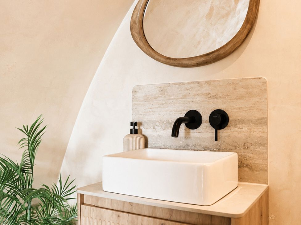 A bathroom with a sink and mirror at The Hog Hut in Llanarth