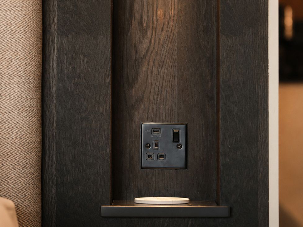 A charging station with USB port and electrical outlet at The Hog Hut in Llanarth
