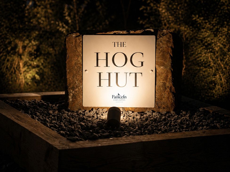 A sign for The Hog Hut at Pantcefn in Llanarth