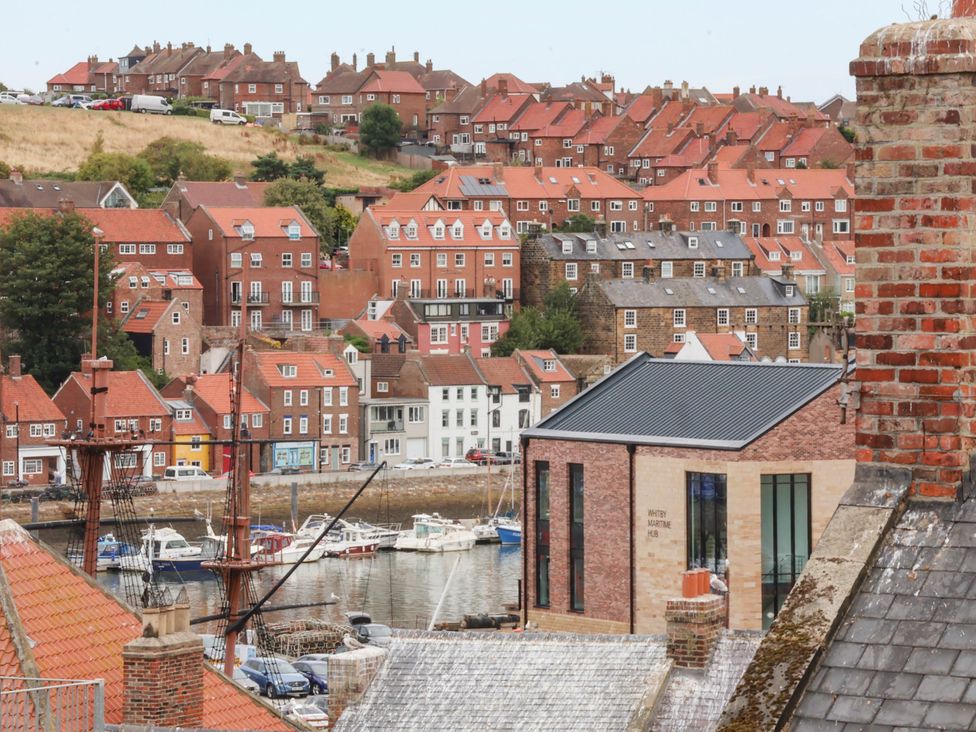 A view of houses and boats in Whitby Harbor at 14 Brunswick Street Whitby