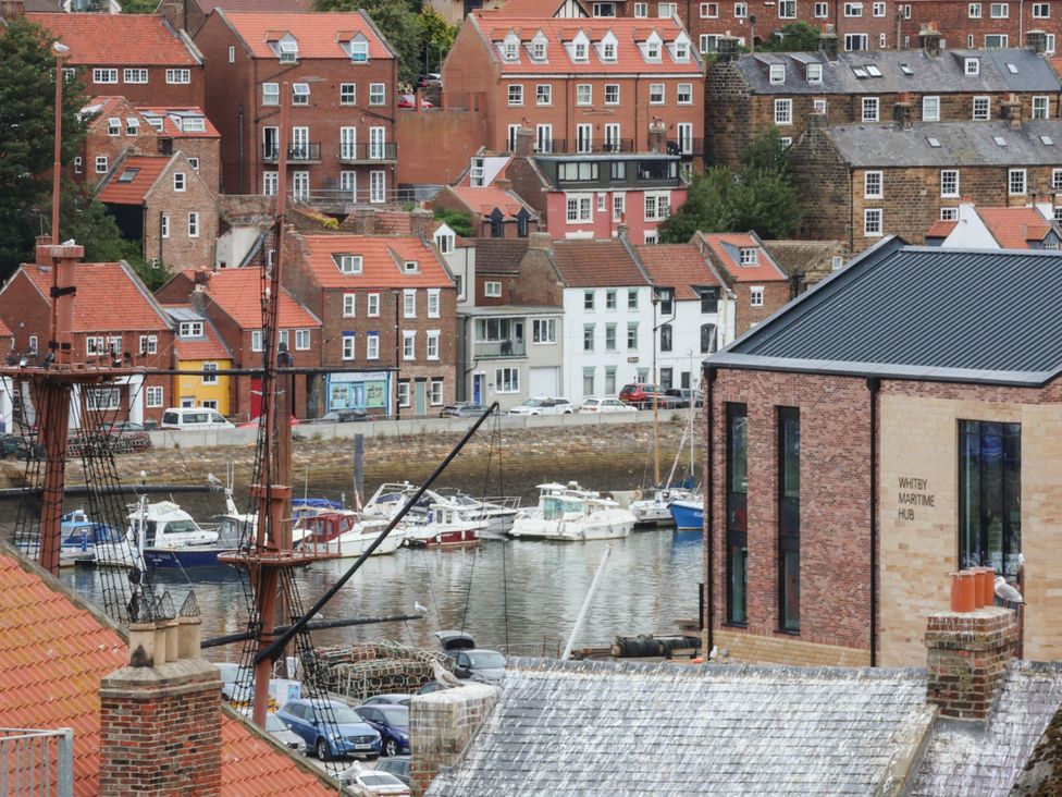 A view of buildings and boats at the Whitby Maritime Hub in Whitby