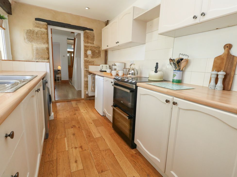A kitchen with appliances and wooden countertops at 57 High Street in Portland