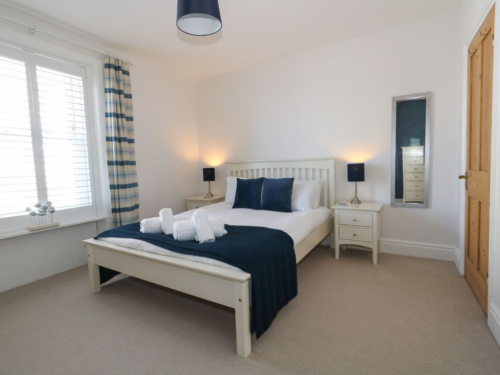 A bedroom with a bed and bedside table at 57 High Street in Portland