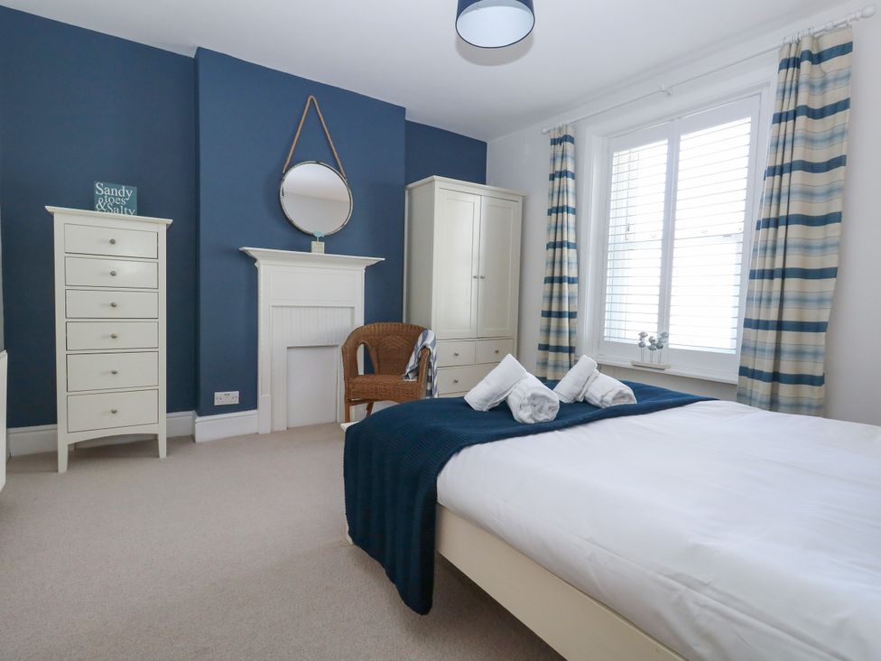 A bedroom with a bed and chest of drawers at 57 High Street Portland
