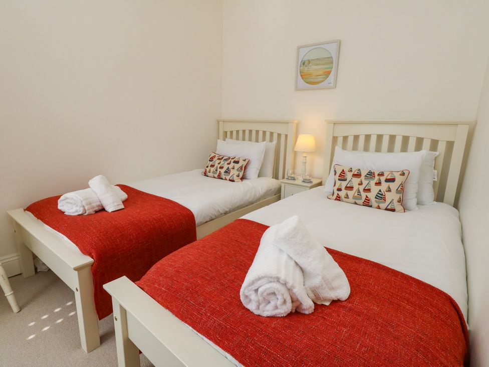 A bedroom with two beds and pillows at 57 High Street in Portland